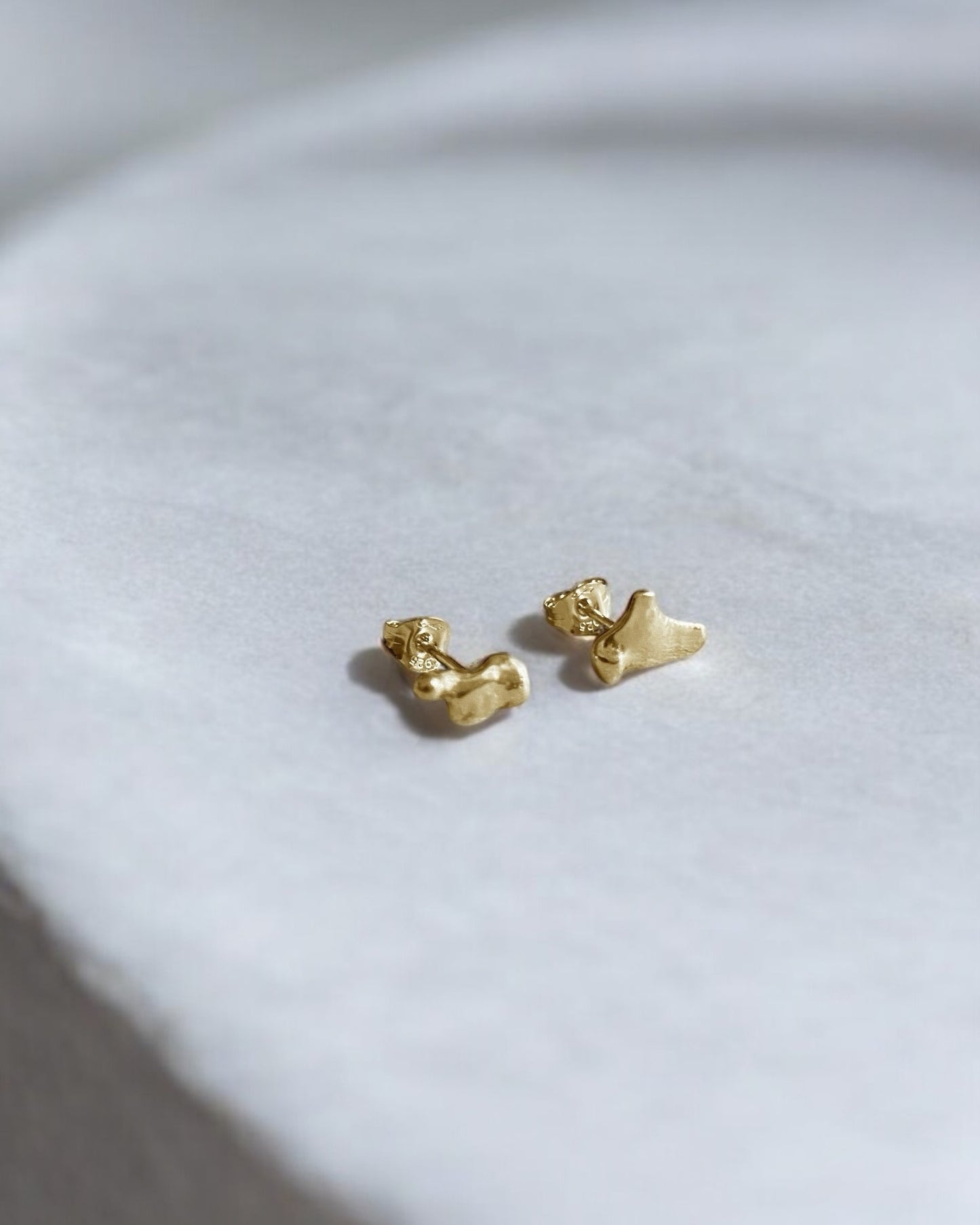 Abstract Mismatched Gold Studs